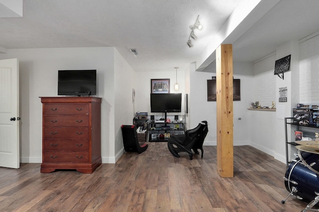 office featuring a textured ceiling and dark hardwood / wood-style flooring