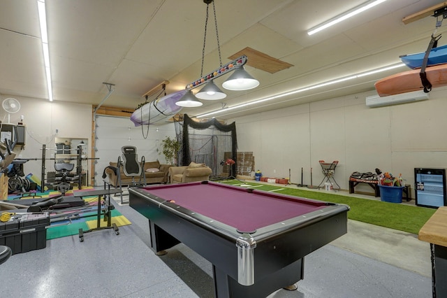 recreation room with pool table and an AC wall unit