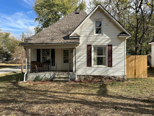 view of front facade with a porch and a front yard