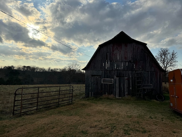 view of outbuilding with a lawn