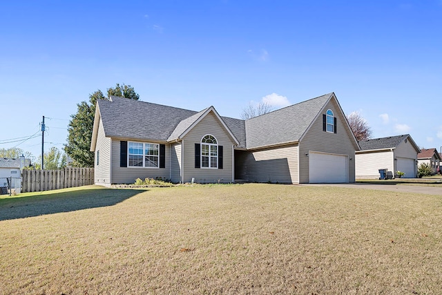 view of front facade featuring a front yard and a garage