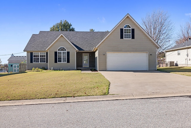 view of front of home featuring a garage, central air condition unit, and a front lawn