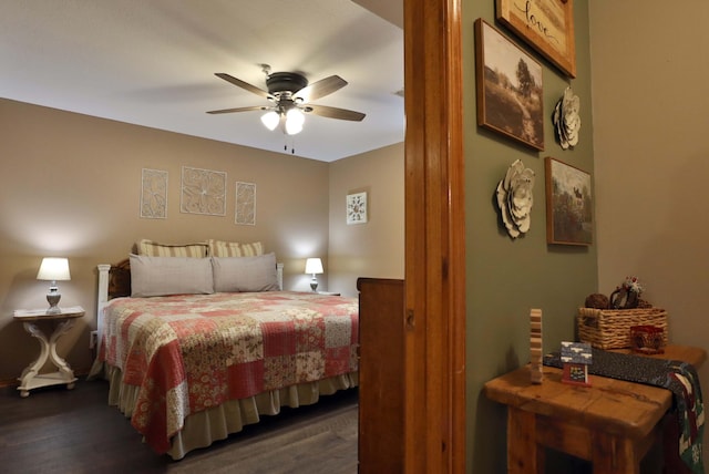 bedroom featuring ceiling fan and dark hardwood / wood-style floors