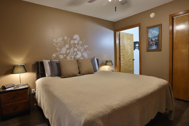 bedroom featuring dark hardwood / wood-style flooring and ceiling fan