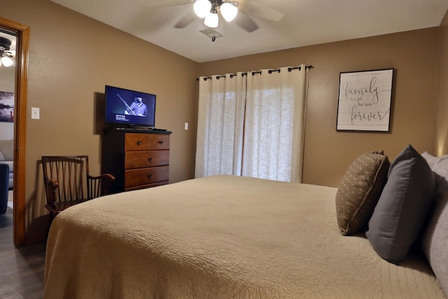 bedroom featuring dark wood-type flooring and ceiling fan