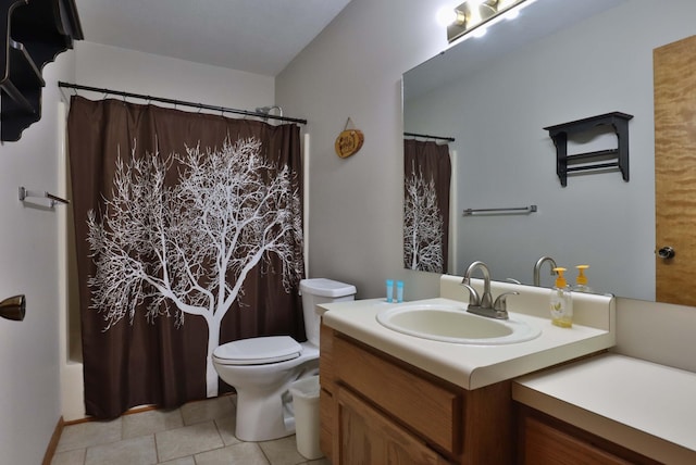 full bathroom featuring vanity, shower / bath combo with shower curtain, tile patterned flooring, and toilet