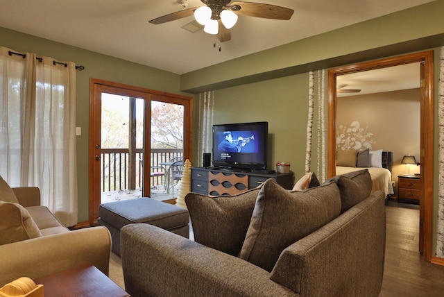 living room with hardwood / wood-style floors and ceiling fan