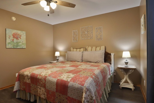 bedroom with ceiling fan and dark hardwood / wood-style floors