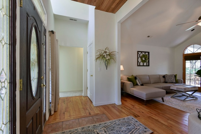 foyer with light hardwood / wood-style flooring, wood ceiling, ceiling fan, and vaulted ceiling