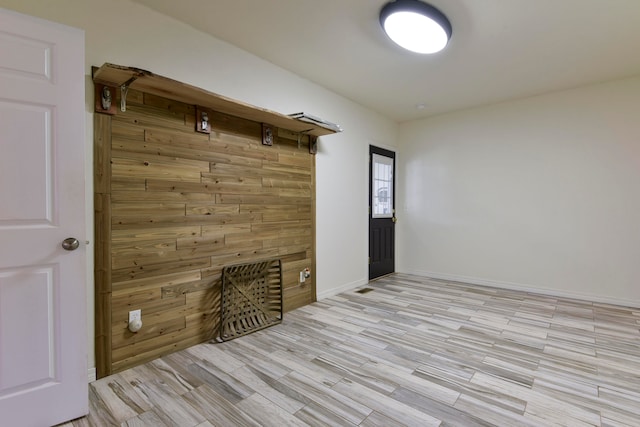 mudroom with light hardwood / wood-style floors