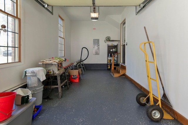 garage with electric panel and a garage door opener