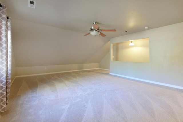 additional living space with carpet floors, lofted ceiling, and ceiling fan