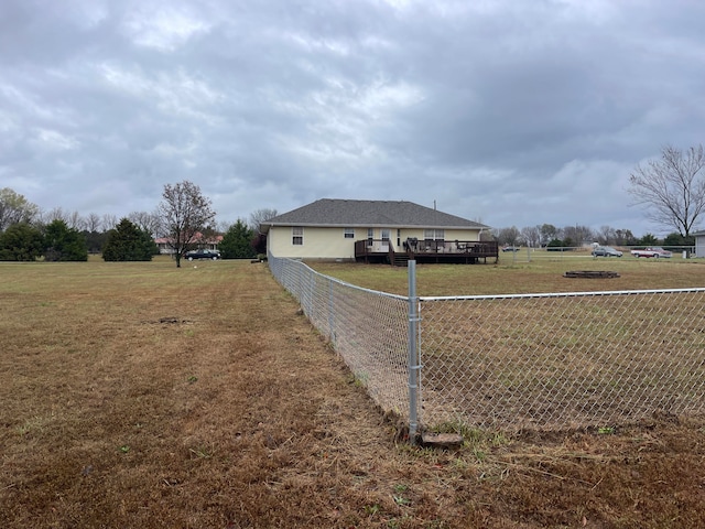 view of side of property with a lawn