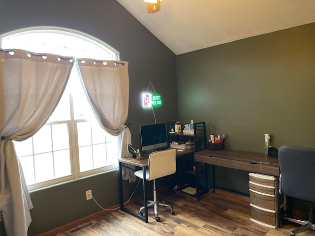 office featuring lofted ceiling, hardwood / wood-style flooring, and ceiling fan