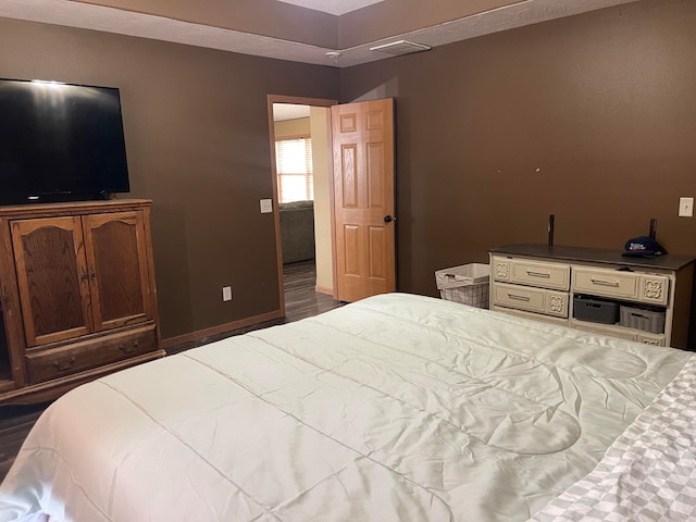 bedroom featuring hardwood / wood-style floors