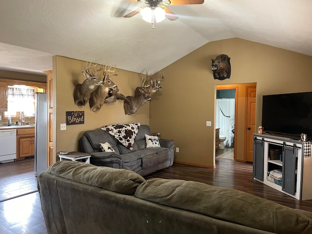 living room with dark wood-type flooring, sink, lofted ceiling, and ceiling fan