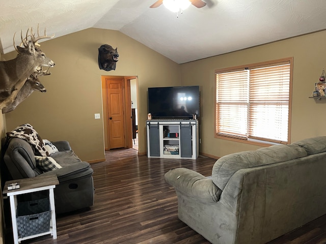 living room with ceiling fan, lofted ceiling, and dark hardwood / wood-style floors