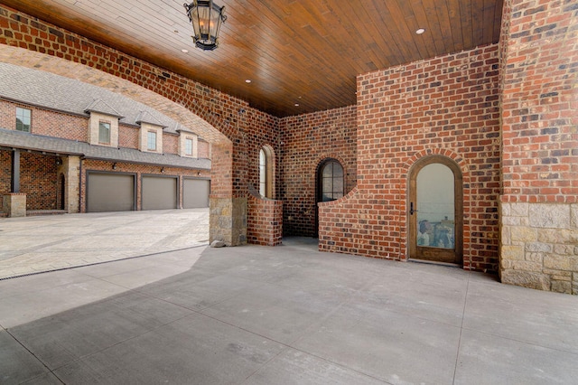 view of patio / terrace featuring a garage