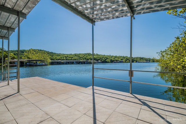 view of pool with a water view