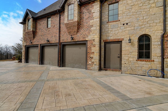 view of property exterior featuring a garage