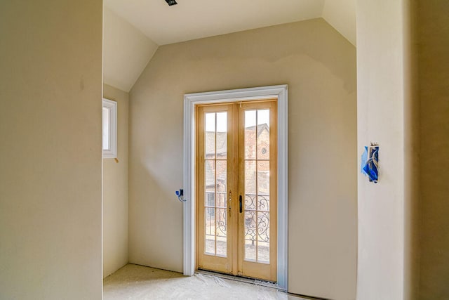 doorway featuring french doors and vaulted ceiling