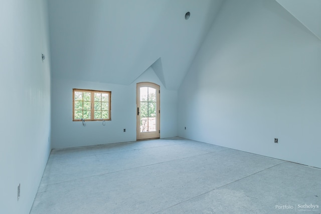 empty room with lofted ceiling