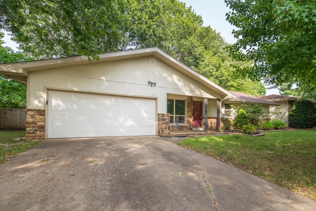 view of front facade with a garage and a front yard