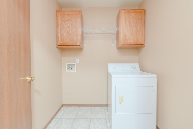 laundry room with washer / clothes dryer and cabinets