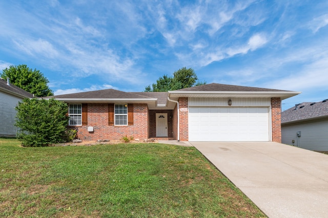 ranch-style house featuring a garage and a front yard