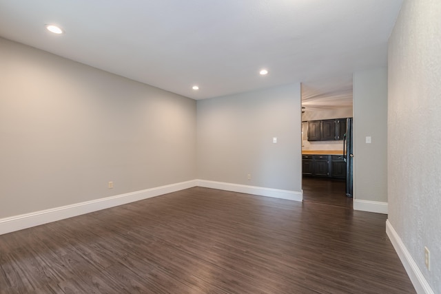 spare room featuring dark hardwood / wood-style flooring