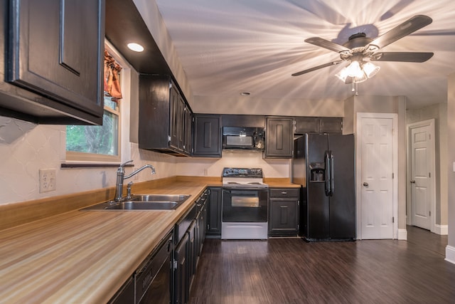 kitchen featuring dark hardwood / wood-style flooring, black appliances, sink, and ceiling fan