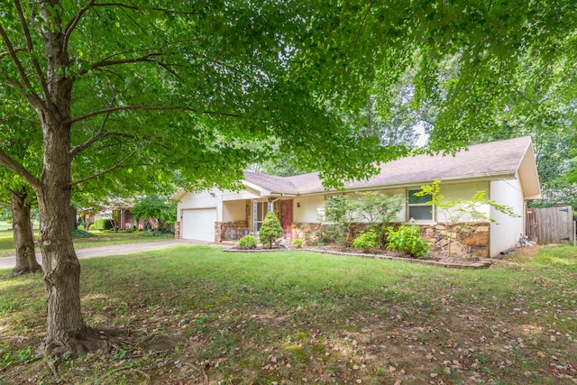 ranch-style house with a garage and a front yard