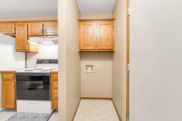 kitchen featuring a textured ceiling and electric range