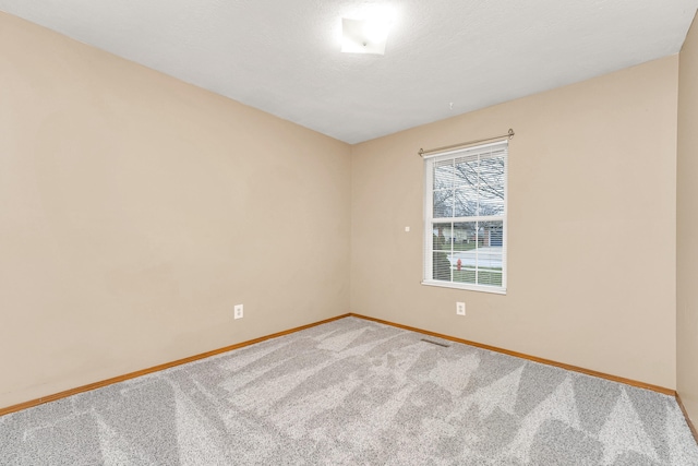 unfurnished room with carpet floors