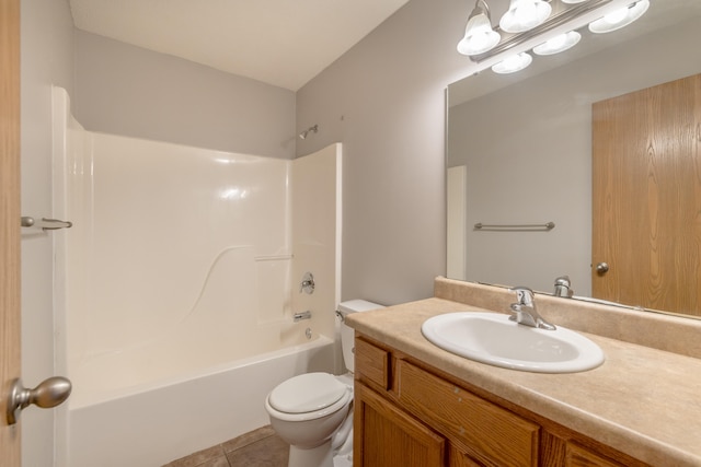 full bathroom featuring tile patterned flooring, washtub / shower combination, toilet, and vanity