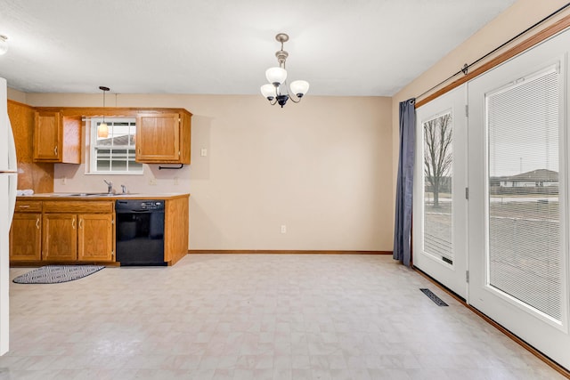 kitchen featuring pendant lighting, sink, dishwasher, and an inviting chandelier