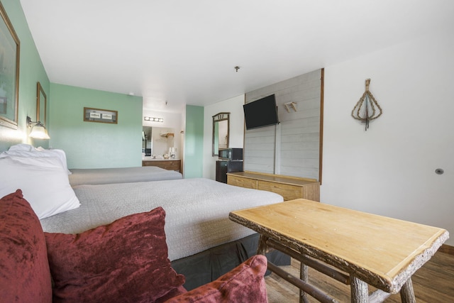 bedroom with dark hardwood / wood-style flooring