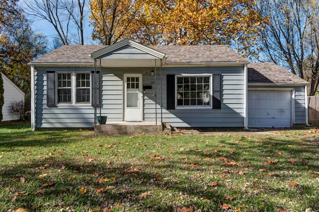 view of front of home with a garage and a front yard