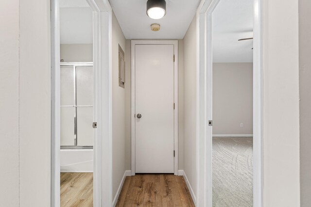 hallway with light wood-type flooring