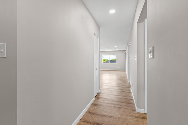 hallway with light wood-type flooring