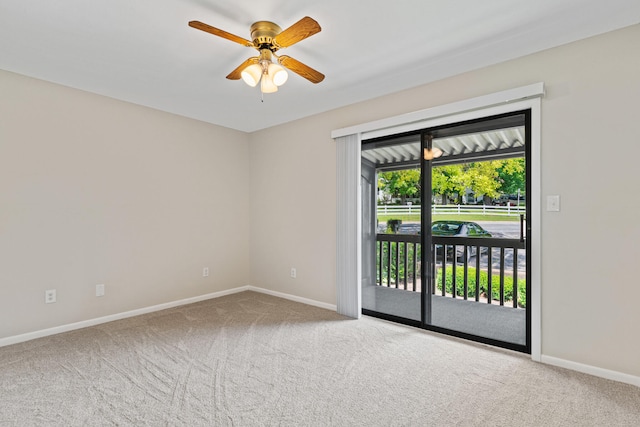 carpeted empty room with ceiling fan