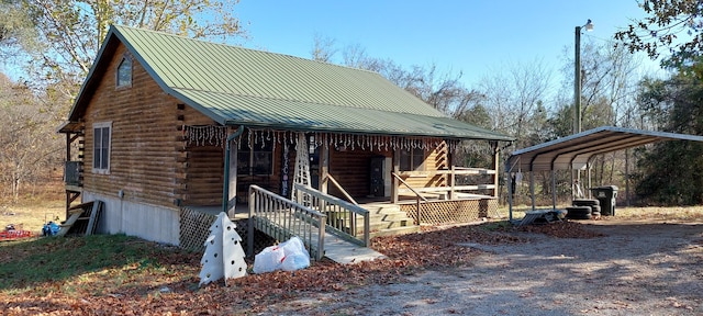 exterior space featuring a porch and a carport