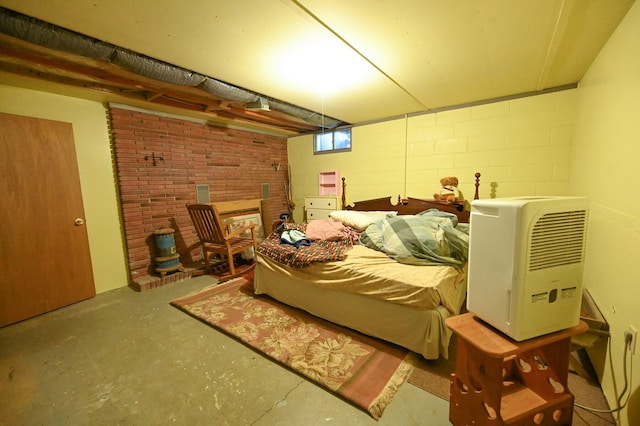 bedroom featuring concrete floors and heating unit