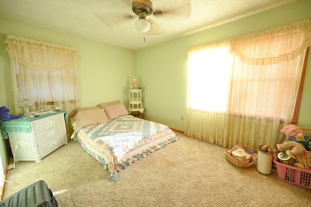 bedroom with ceiling fan and carpet