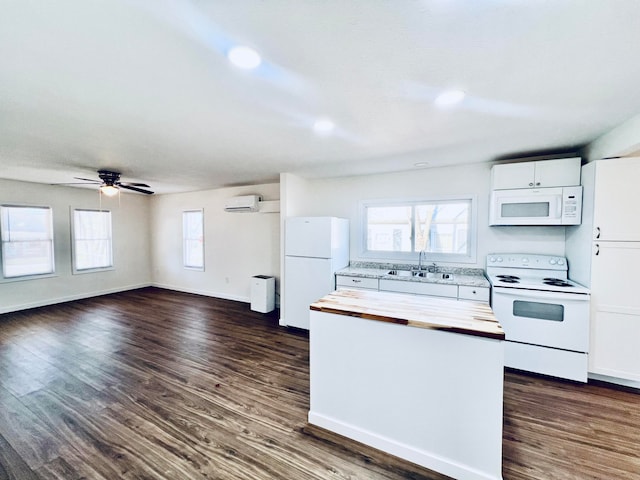 kitchen featuring sink, ceiling fan, white appliances, white cabinets, and dark wood-type flooring