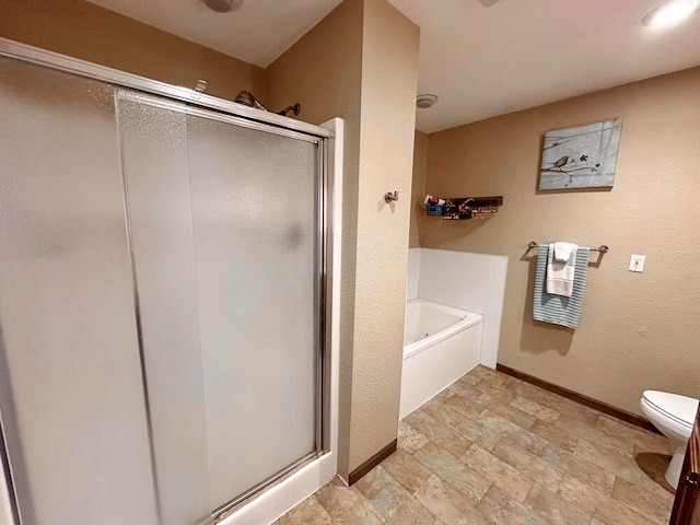 bathroom featuring toilet and plus walk in shower