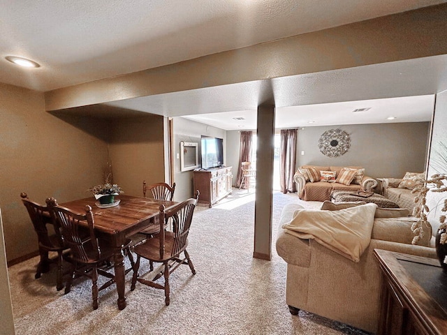 view of carpeted dining area