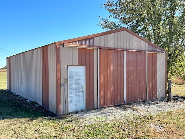 view of outbuilding with a lawn