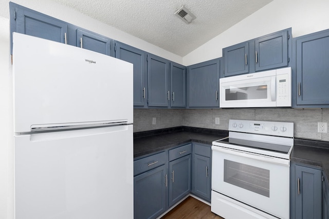 kitchen featuring vaulted ceiling, a textured ceiling, blue cabinetry, backsplash, and white appliances