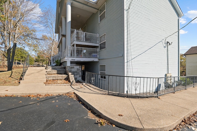 view of side of property featuring a balcony